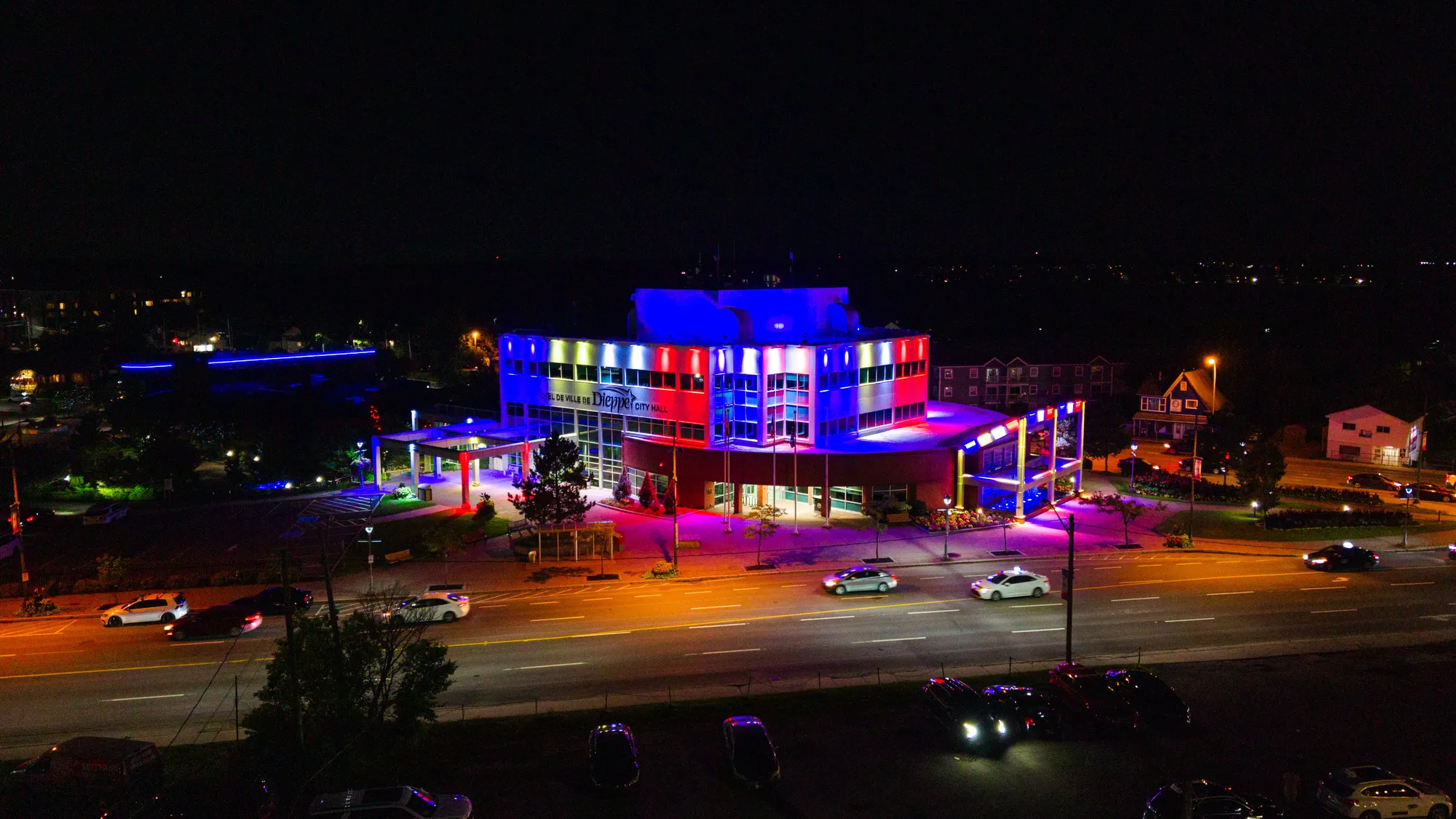 Dieppe City Hall lit in blue, white and red after dark
