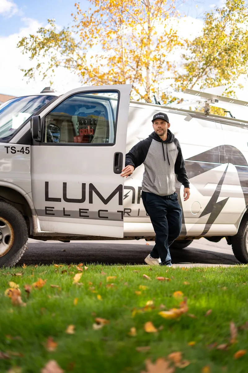 LuMar Electric electrician walking from his service van to a home in Moncton
