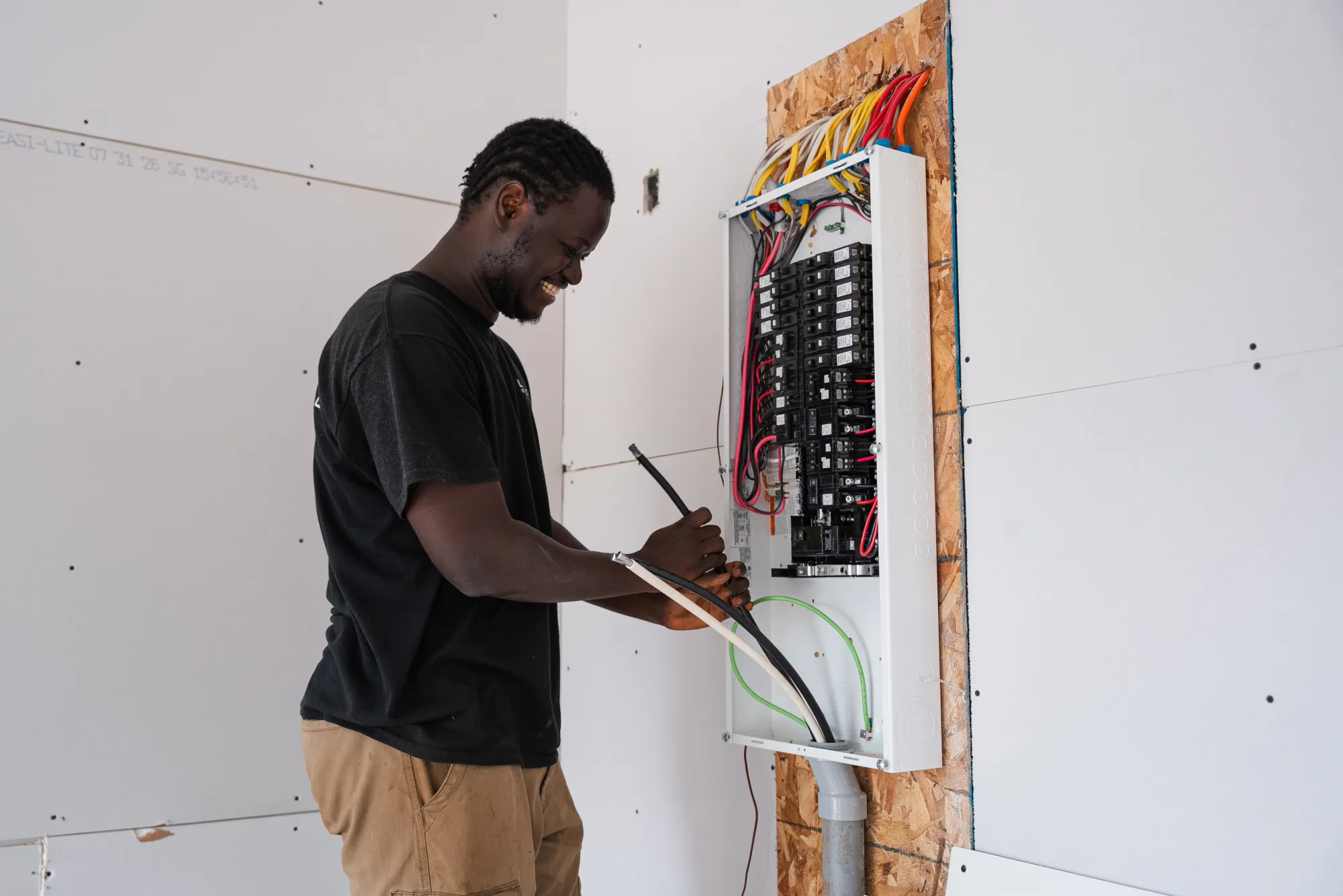 LuMar Electric technician wiring a residential breaker panel