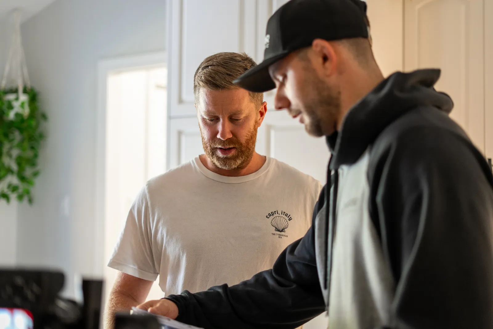 A LuMar Electric electrician going over the work with a homeowner