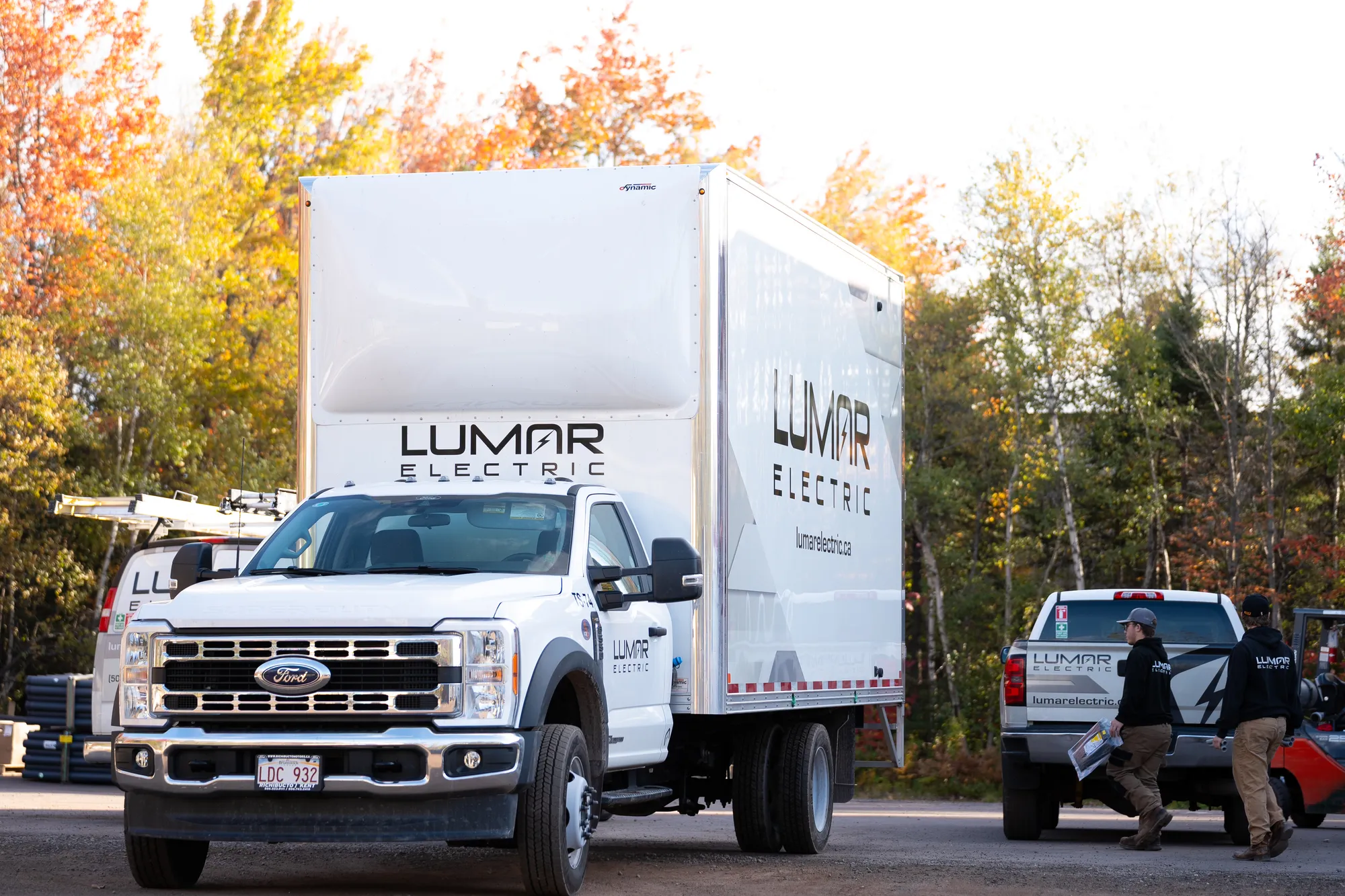 LuMar Electric crew members loading up beside the company truck