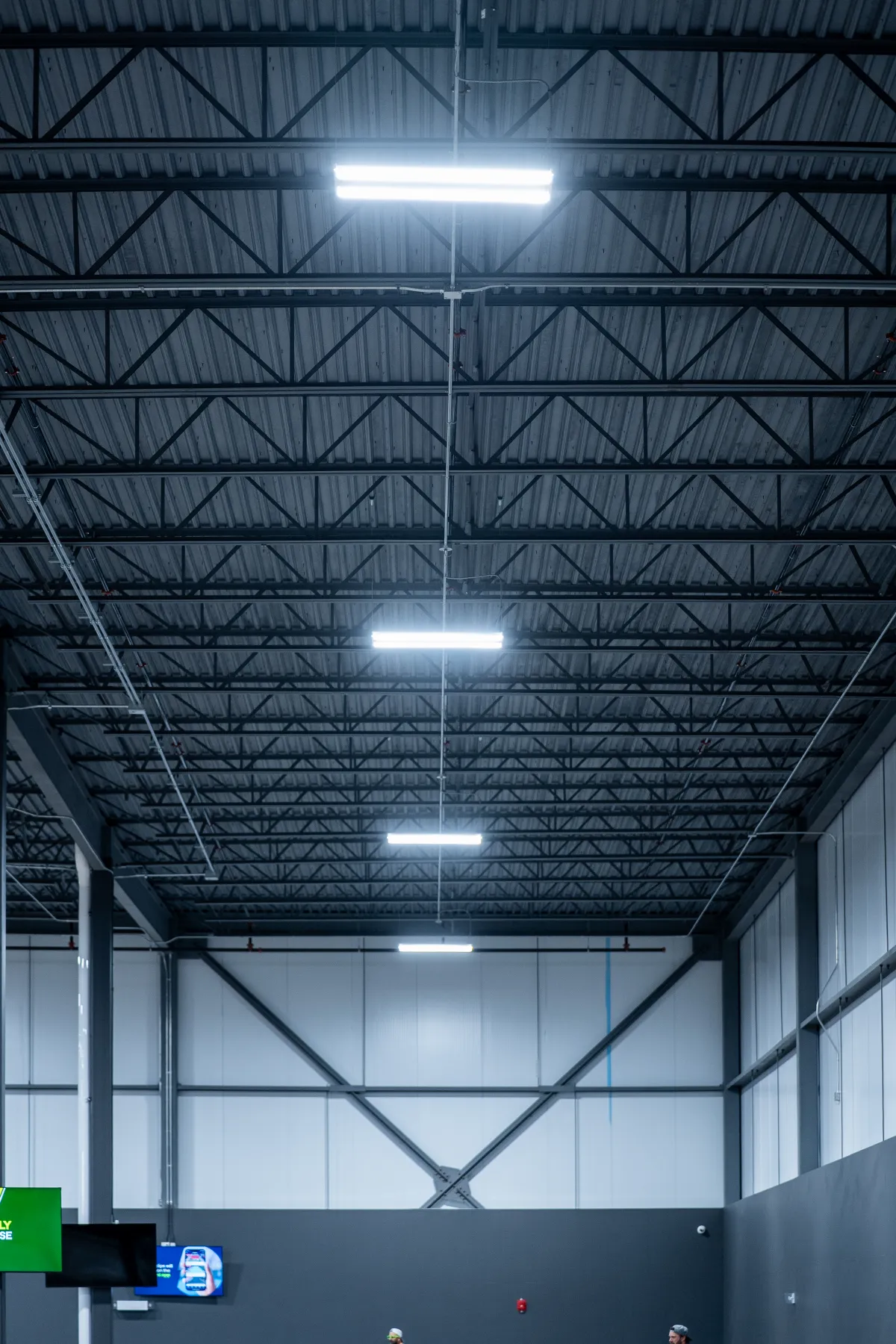 Court lighting installed by LuMar Electric under the steel roof at Rally House