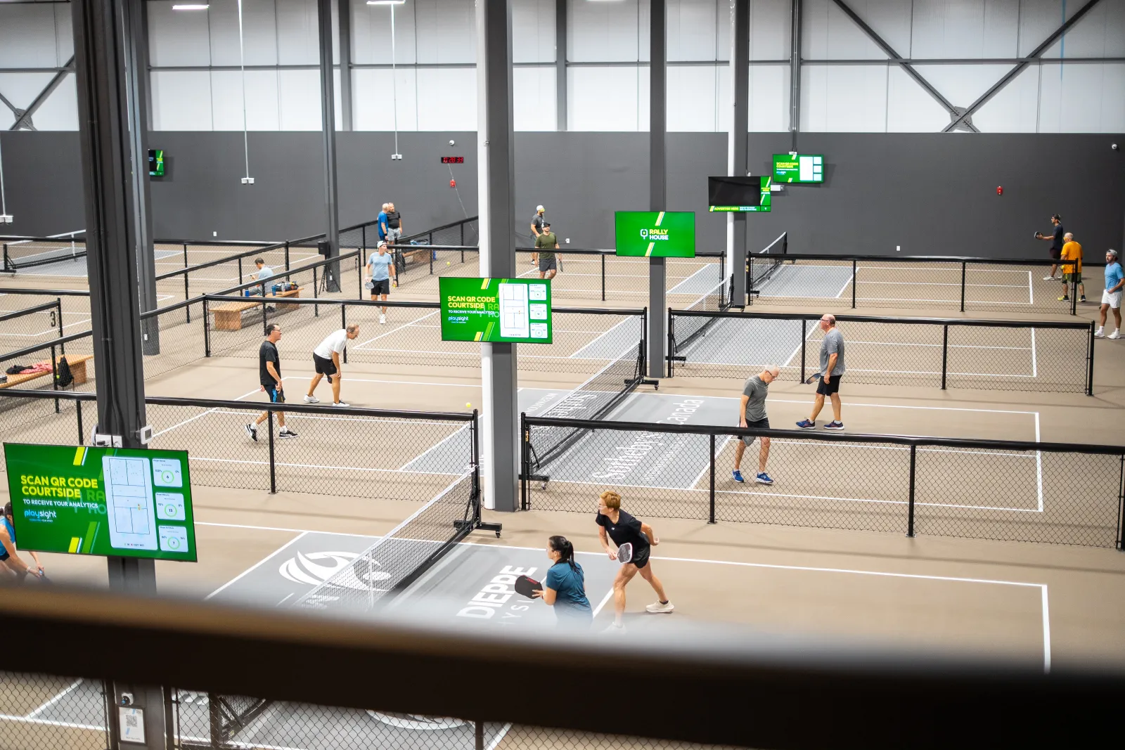 Players on the indoor courts at Rally House Pickleball