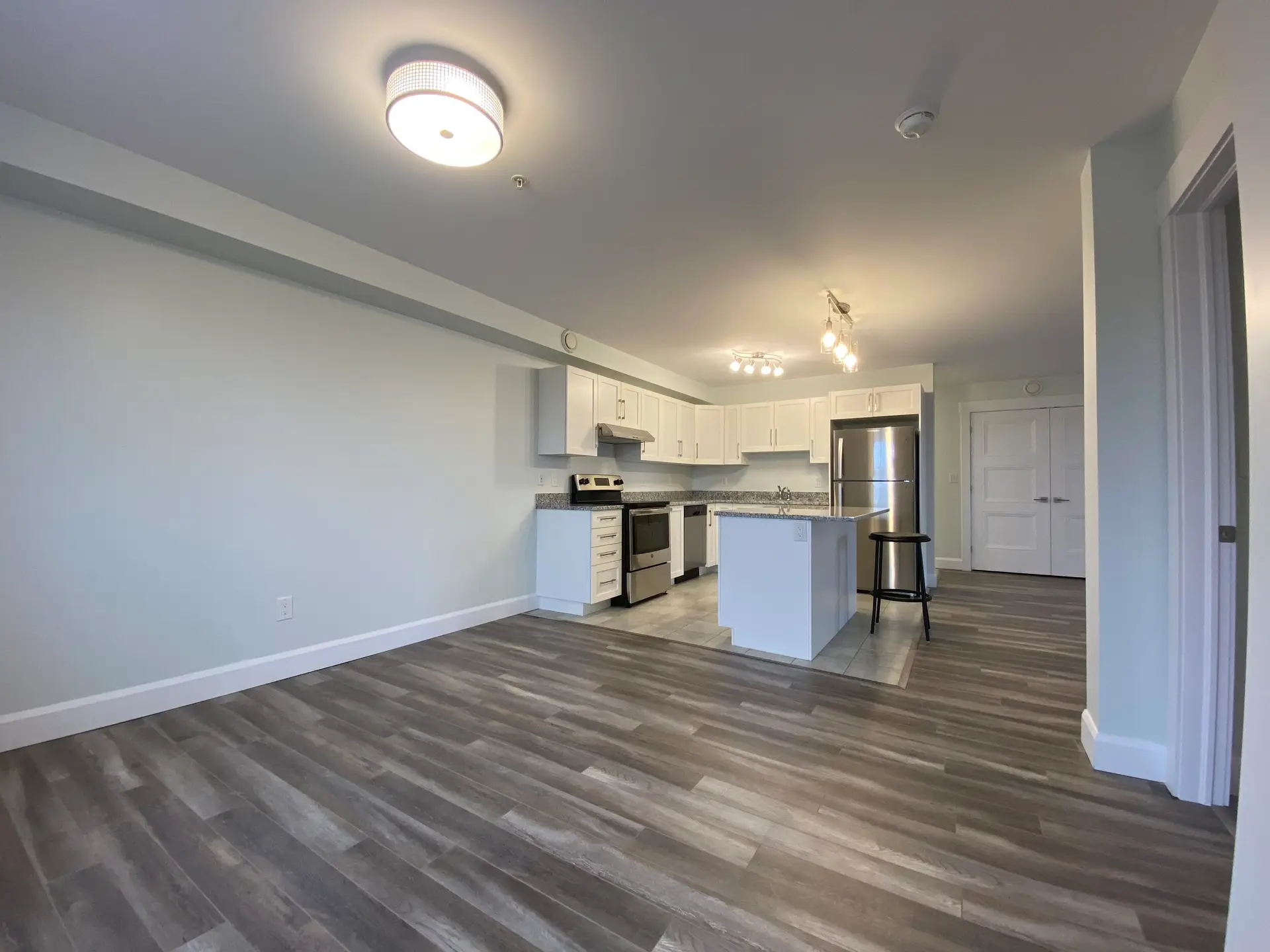 Modern kitchen with island and wood flooring